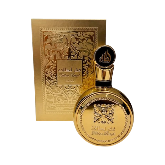 Perfume femenino Fakhar Lattafa Gold de BodegaPerfumera13 en frasco esférico dorado con caja decorativa a juego.