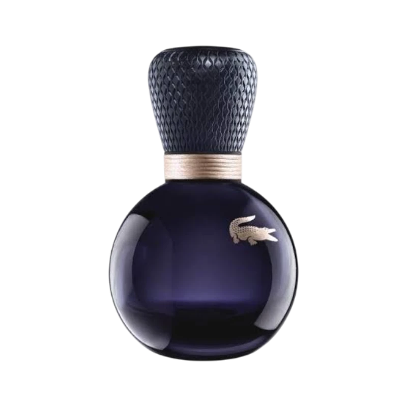 Perfume Lacoste Sensuelle de BodegaPerfumera13 en frasco redondo de cristal oscuro con tapón texturizado y logo dorado