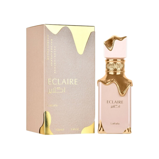 Perfume Eclaire Lattafa de KingParfumCol con frasco y caja en tonos beige y detalles dorados tipo caramelo derretido
